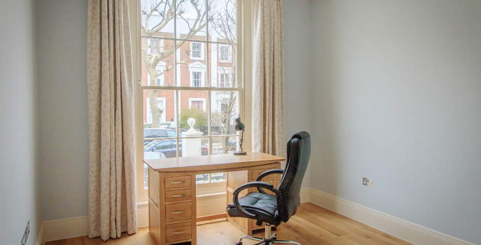 desk and chair by the window